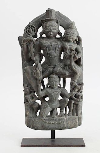 INDIAN BLACK STONE FRAGMENT OF VISHNU AND LAKSHMI SEATED ON GARUDA, WESTERN INDIA