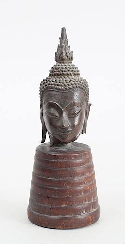 TWO SOUTHEAST ASIAN BRONZE HEADS OF BUDDHA