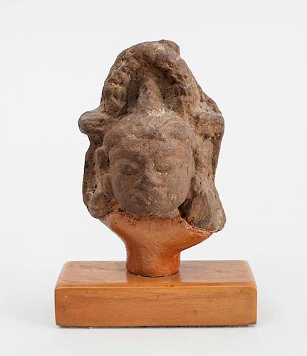 INDIAN CARVED SANDSTONE FRAGMENT OF A HEAD OF A DEITY
