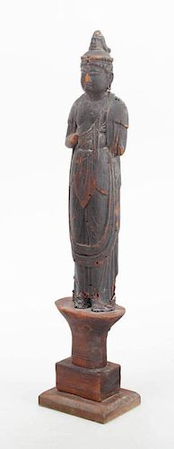 JAPANESE CARVED AND BLACK PAINTED WOOD FIGURE OF KANNON