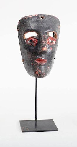 TWO LATIN AMERICAN BLACK-GROUND PAINTED WOOD MASKS