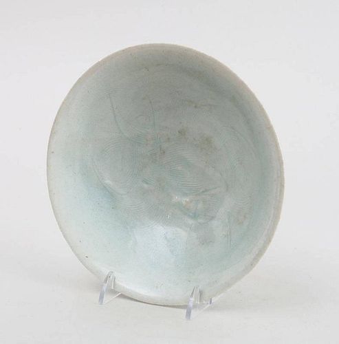 CHINESE ENGRAVED AND CELADON GLAZED POTTERY FOOTED SHALLOW BOWL