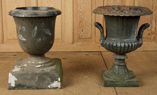 TWO PAINTED CAST IRON GARDEN URNS