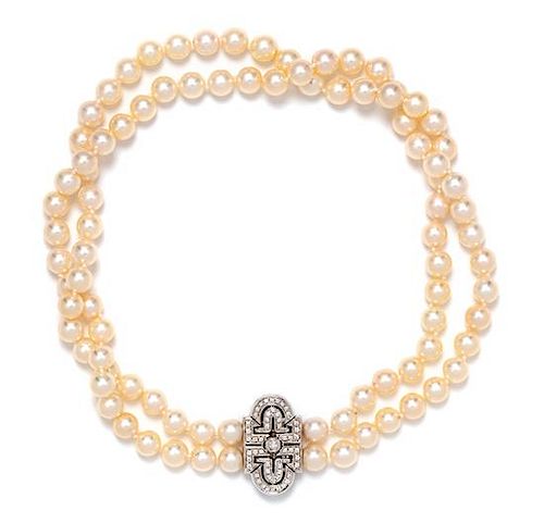 An 18 Karat White Gold, Double Strand Cultured Pearl and Diamond Necklace, Italian, 55.10 dwts.
