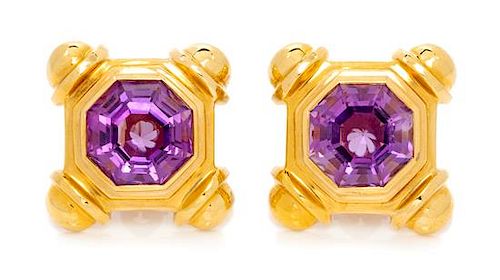 A Pair of Yellow Gold and Amethyst Earclips, 20.70 dwts.