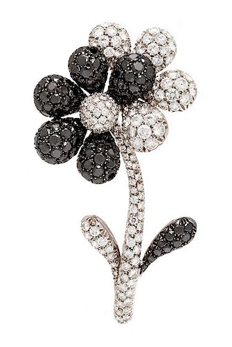 An 18 Karat White Gold, Diamond and Black Diamond Flower Brooch, RCM Gioielli, 18.00 dwts.