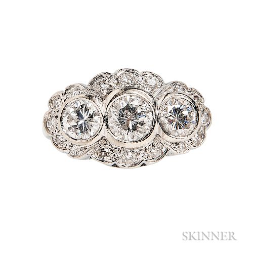 18kt White Gold and Diamond Ring, bezel-set with three full-cut diamonds weighing approx. 0.75, 0.50, and 0.50 cts., framed by full-cut