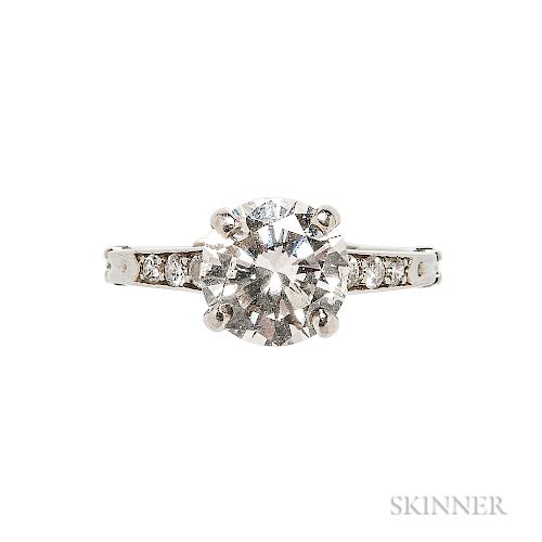 Platinum and Diamond Solitaire, Tiffany & Co., prong-set with a full-cut diamond weighing approx. 1.80 cts., the shoulders set with dia