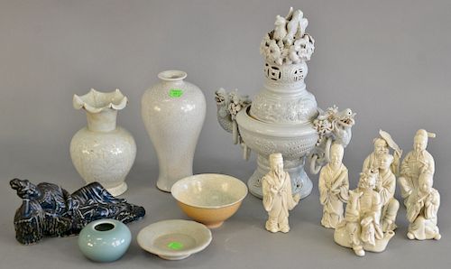 Group of Chinese porcelain pieces to include seven white glazed figures, blue glazed laying guanyin (ht. 13 in.), yellow glazed cup,...