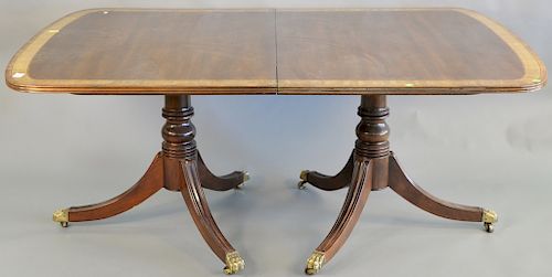 Custom mahogany double pedestal dining table with two 22 inch leaves. ht. 28 1/2 in., top: 45" x 67" opens to 111 in.