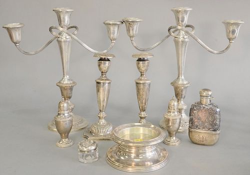 Group of sterling silver to a pair of sterling silver weighted candelabras (ht. 12 1/4 in.), candlesticks, salt and pepper, small bo...