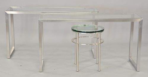 Three piece lot to include a pair of stainless and glass hall tables (ht. 29 in., top: 18" x 54"), plus small round table (ht. 23 in...