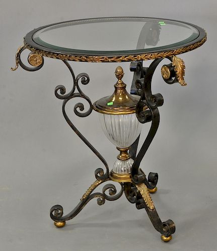 Iron brass and glass round table, attributed to Maitland Smith. ht. 30 1/2 in., dia. 26 1/4 in.