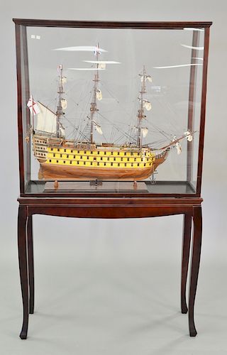 Four piece lot to include HMS Victory ship model, in glass case on stand (ht. 69 in., wd. 40 in.) and three large brass candlesticks.