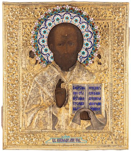 A RUSSIAN ICON OF ST. NICHOLAS THE WONDERWORKER WITH GILT SILVER AND SHADED CLOISONNE AND CHAMPLEVE ENAMEL OKLAD, 1908-1917 