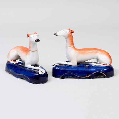 Pair of Staffordshire Pottery Quill Holders in the Form of Recumbent Greyhounds