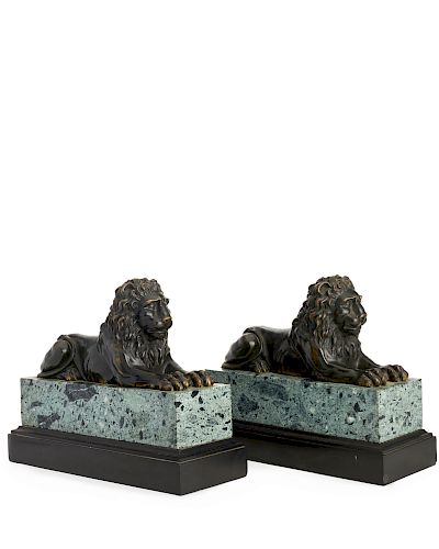 A pair of Continental patinated bronze lions