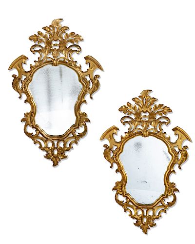 A pair of Rococo style carved giltwood mirrors