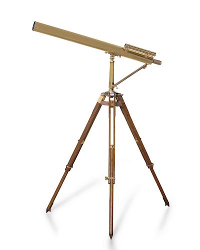 A brass telescope on adjustable oak folding stand