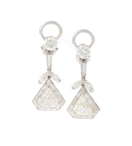 A pair of diamond and platinum dangle earrings