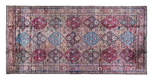 * A Kirman Wool Carpet 23 feet 6 inches x 11 feet 2 inches.