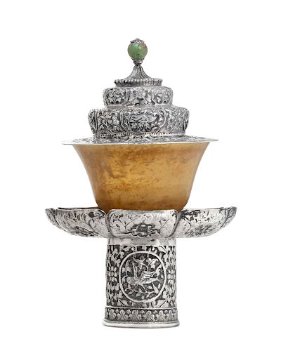 A Tibetan silver covered stand