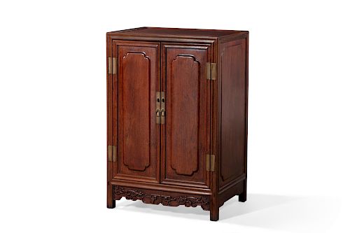 A Chinese carved hardwood side cupboard