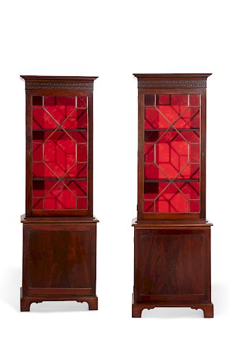 A pair of George III style mahogany bookcases