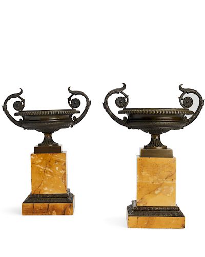 A pair of Charles X bronze and marble urns