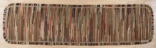 American braided runner with a rag border, 156'' x 41''.