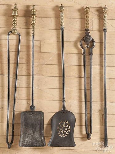 Group of brass and iron fireplace tools, to include two shovels, two tongs, and a poker.