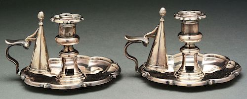 A Pair of English Silver Chambersticks.