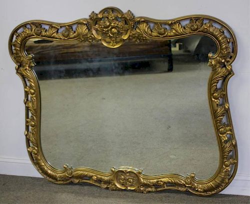Carved and Giltwood Floral Decorated Mirror.