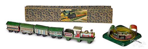 Two lithograph tin train penny toys