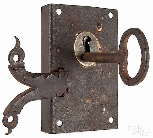 Wrought iron and brass door lock, early 19th c., with its original key, plate - 5 1/2'' x 3 1/2''.