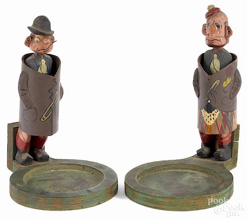Two carved and painted comic erotic figures, early 20th c., each with a man cloaked in a cardboard