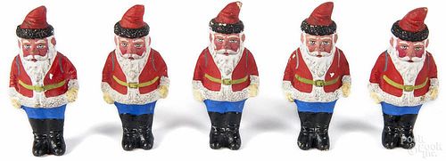 Five composition Santa Claus figures, early 20th c., 3 1/2'' l.