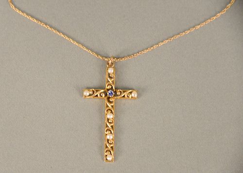 14 karat gold cross and chain, set with one blue stone and six small pearls. ht. 1 3/4 in., 3.8 grams total weight