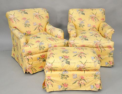 Four piece lot to include upholstered club chairs with one pair having an ottoman along with an additional club chair. Provenance: A...