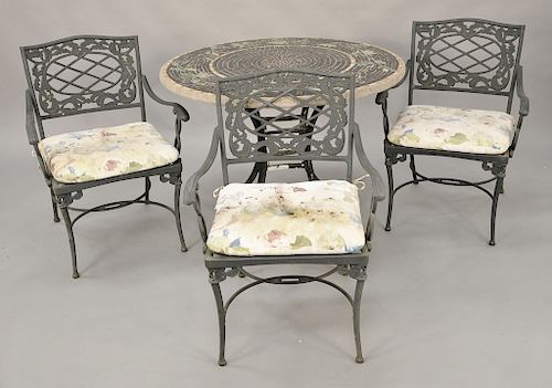 Mosaic tile outdoor table and three outdoor armchairs. ht. 29 in., dia. 42 in. Provenance: From the Estate of Deborah G. Black of Gr...