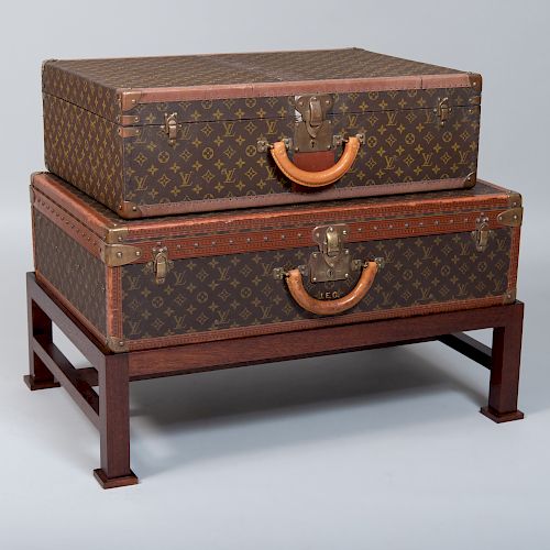 Two Louis Vuitton Suitcases on Stand