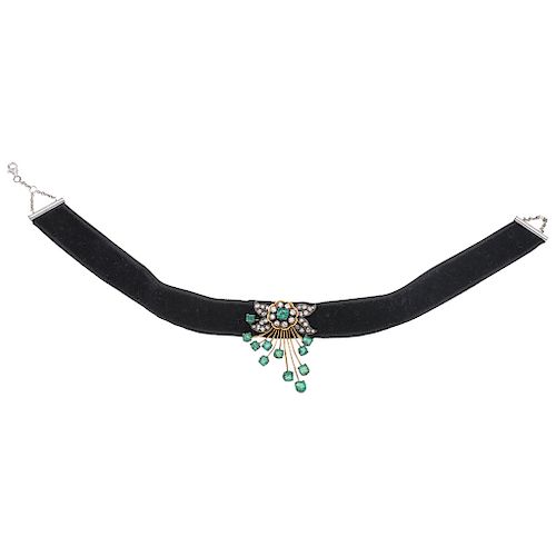 An emerald and diamond 14K yellow and white gold pendant with velvet choker.