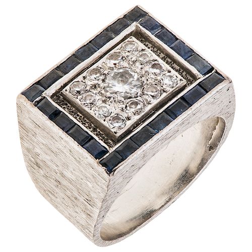 A diamond and sapphire palladium silver ring.