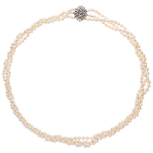 A cultured pearl necklace with a diamond 14K white gold clasp.