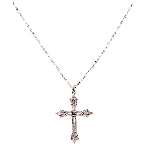 A sapphire and diamond palladium silver cross pendant and 18K white gold necklace.