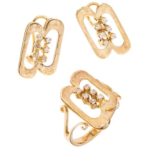 A diamond 10K yellow gold ring and pair of earrings set.