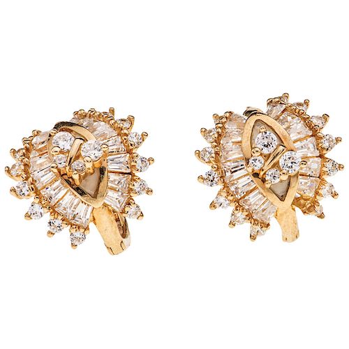 A diamond 14K yellow gold pair of earrings.