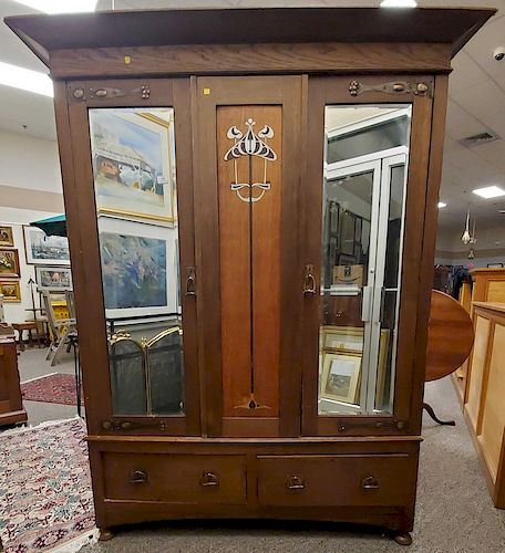 Victorian oak armoire with two mirrored doors and pewter inlay.