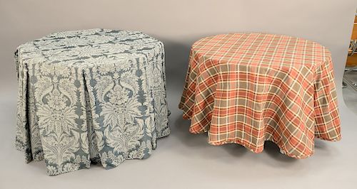 Two tables with custom upholstered table cloths, one in shape of octogon (ht. 30 in., dia. 43 in.) and the other is circular (ht. 29 1/2 in., dia. 42 