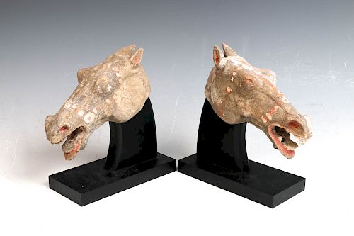 TWO POTTERY HORSE HEADS, HAN DYNASTY